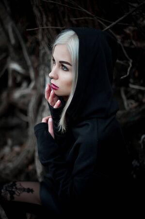 Shot of a gothic woman in a forest. Fashion.