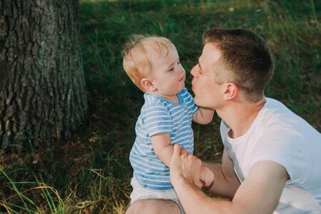 Little boy 1 year old with his father playingの写真素材