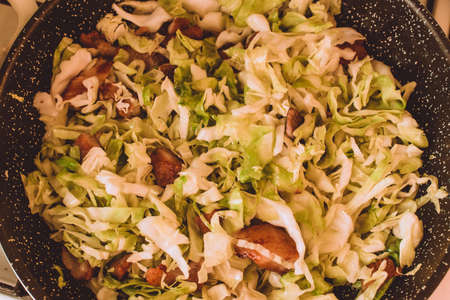 Food ingridients: red beans, carrot, cabbage, meat, onion, ginger for recipe stewed beans with meat on wooden background. Steps in cooking, process of preparing food. Concept of homemade healthy food. Flatlay, top viewの写真素材