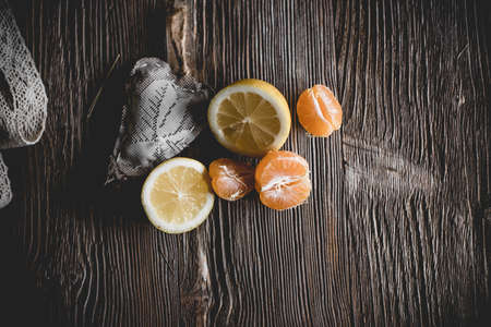 Lots ripe citrus on wooden backgroundの写真素材