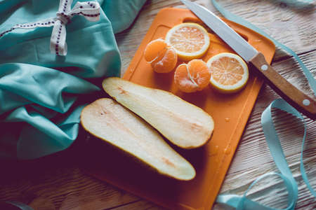 Citrus fresh fruits on a wooden table, close-up.の写真素材