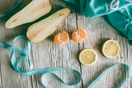 Citrus fresh fruits on a wooden table, close-up.の写真素材