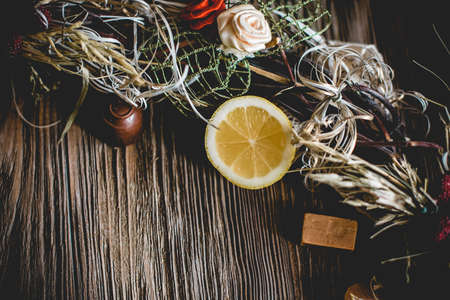 Creative Christmas wreath. An unusual idea for a holiday home decor. Natural interior decor on wooden background.の写真素材