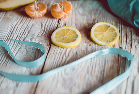 Citrus fresh fruits on a wooden table, close-up.の写真素材