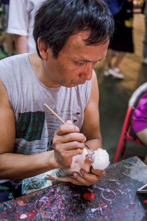 Hangzhou, China - August1, 2017: Street fo tourists, traditional street food and so?veniers, old historical architecture and museums.のeditorial素材