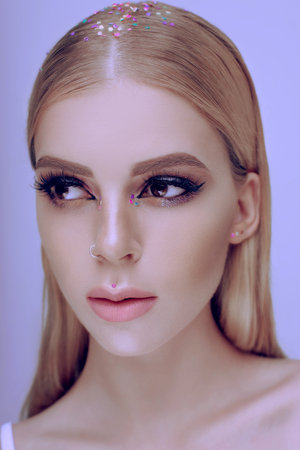 Beautiful woman portrait with bright evening make-up blonde hair and healthy skinの写真素材
