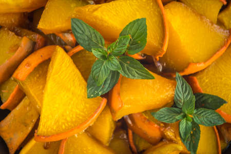 Baked pumpkin slices with cinnamon and honeyの写真素材