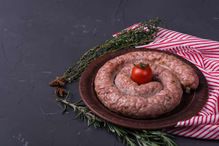 Homemade baked sausage with spice and herbsの写真素材