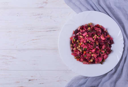 Traditional russian beetroot salad vinaigrette on white plateの写真素材