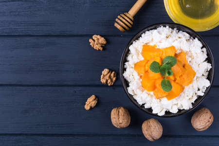 Cottage cheese with pumpkin slice,mint and walnutの写真素材