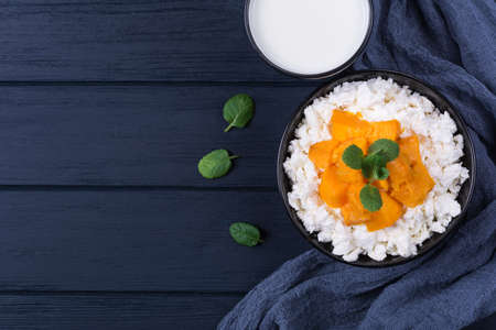 Cottage cheese with pumpkin slice,mint and walnutの写真素材