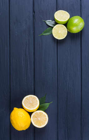 Fresh ripe lime and lemon on dark backgroundの写真素材