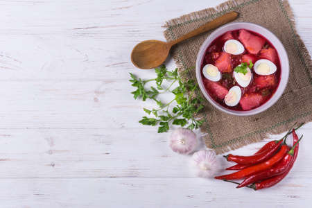 Ukrainian russian traditional vegetarian red soup - borsch with quail eggs