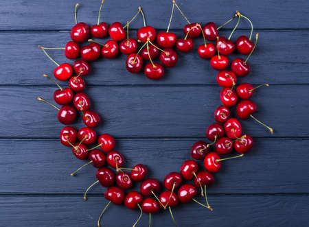 Fresh sweet cherries with stalks large collection of fresh red cherriesの写真素材