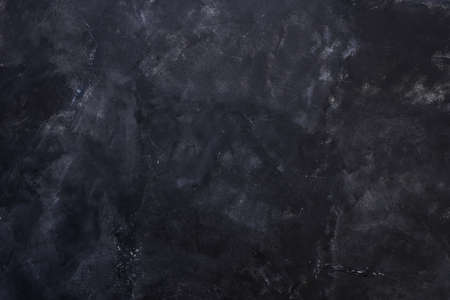 Old black background. Grunge texture. Dark wallpaper. Blackboard Chalkboardの写真素材