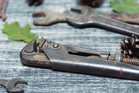 Different old vintage tools on a black and white wooden backgroundの写真素材