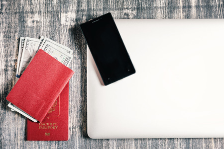 Russian passport with dollars on black and white background. Preparing for travelの写真素材