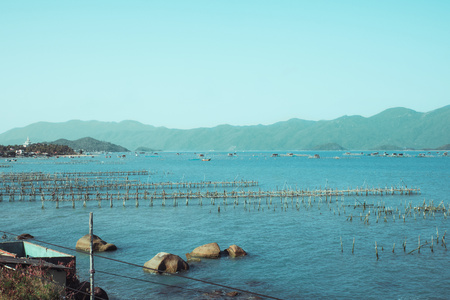 The bay and harbor at Vietnam. Beautiful view on blue sky and South China Sea, rocksの写真素材