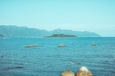 The bay and harbor at Vietnam. Beautiful view on blue sky and South China Sea, rocksの写真素材