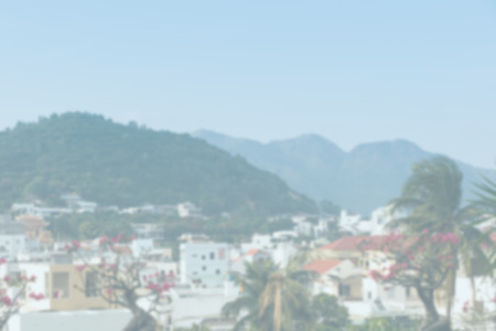 Blurred background of beautiful tropic town. View of Nha Trang, Vietnam with mountains in backgroundの写真素材