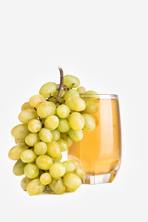 Glass of juice isolated on white background. Glass of fresh apple drink and grapeの写真素材