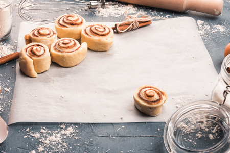Homemade sweet buns on baking paper. Top view. Cope spaceの写真素材