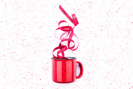 Red cup with tape. Flat lay. Mug isolated on white background with paint drops. Minimal conceptの写真素材