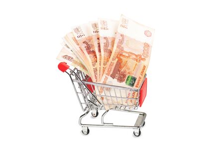 Five thousand Russian rubles bills in a small shopping cart isolated on a white backgroundの写真素材