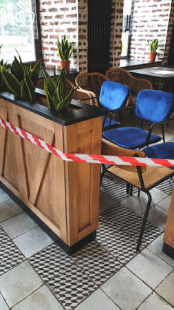 Chairs and tables stacked in a closed coffee shop.