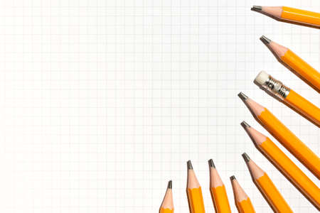 Notebook and yellow pencils. Minimal school or office supplies concept. Flat lay, top view, copy space for textの写真素材