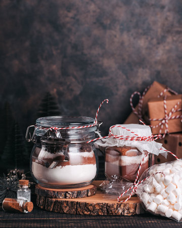 Christmas gift cookie mix and chocolate drink in glass jarの写真素材