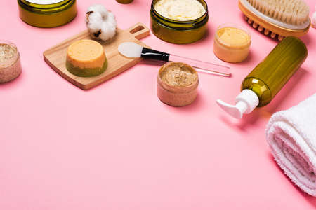 Cosmetic containers with skincare products on pink backgroundの写真素材