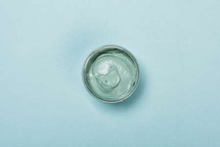 Natural spirulina face clay mask on green backgroundの写真素材