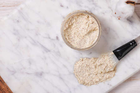 Natural body scrub on marble background. Cosmetic face creamの写真素材