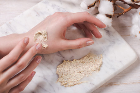 Natural body scrub on marble background. Cosmetic face creamの写真素材