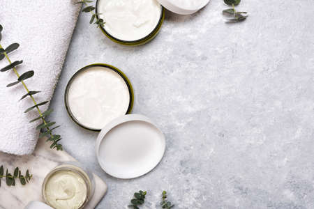 Bottles of essence or serum with natural eucalyptus leavesの写真素材