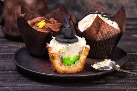 Festive Halloween or birthday cupcakes decorated with magic hatの写真素材