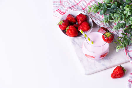 A glass of homemade organic strawberry yogurt with fresh berriesの写真素材