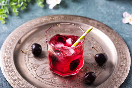 Cold sweet cherry non alcohol drink with iceの写真素材