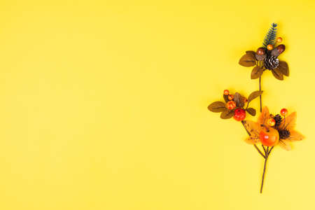 Autumn composition with fall leaves on ultimate yellow backgroun