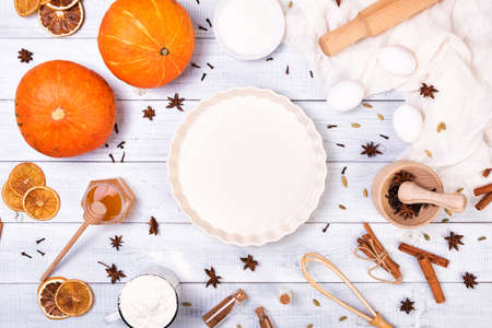 Ingredients for pumpkin pie with cinnamon and pecan nutsの写真素材