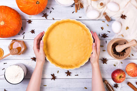 Ingredients for pumpkin pie with cinnamon and pecan nutsの写真素材