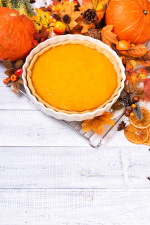 Homemade spicy pumpkin pie with cinnamon and pecan nutsの写真素材