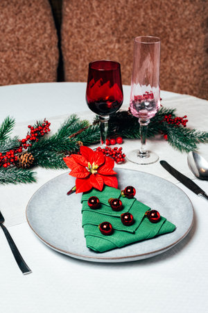 Christmas table setting with ceramic dishware, silver tablewareの写真素材
