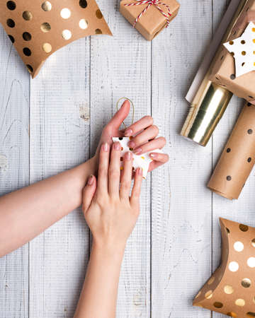 Christmas gift boxes and wrapping paper in gold colorsの写真素材
