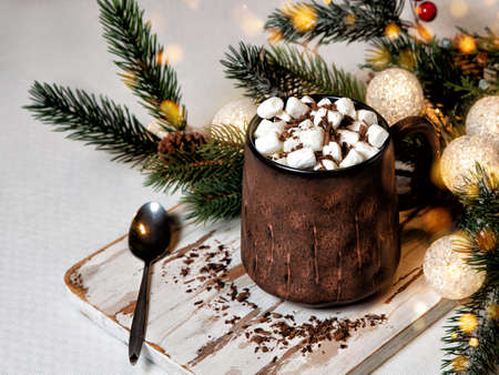 Rustic ceramic mug with a hot chocolate cocoa drink with marshmallows.の写真素材