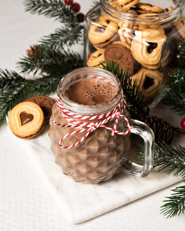 Glass mug with a hot chocolate cocoa drinkの写真素材