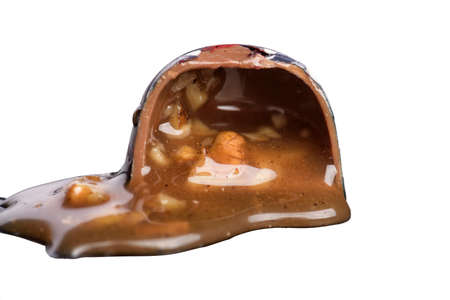 Tasty chopped chocolate candy on white backgroundの写真素材