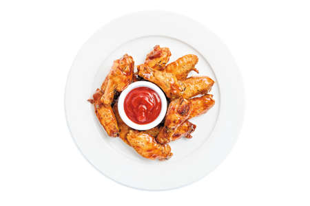 BBQ chicken wings with hot sauce on whiteの写真素材
