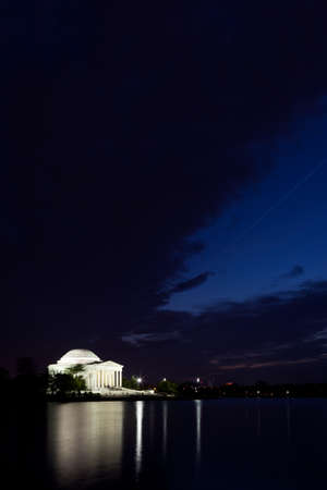 Thomas Jefferson Memorial with reflecting in the Tidal Basin in Washington DC at dusk with dramatic skyのeditorial素材